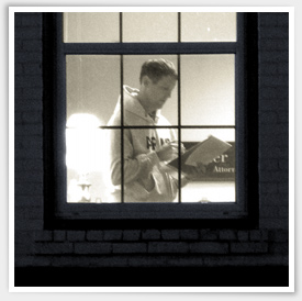 At night, Walter McKee is seen through a window with a light on, reading notes from his pad of paper.